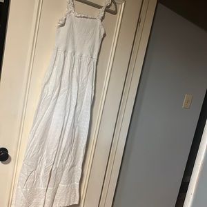 All white jumpsuit has pockets